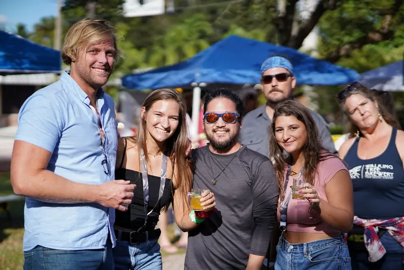 Group of friends in golden evening light at the festival