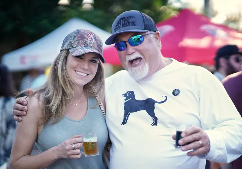 Two people sharing a laugh at Treasure Coast Brew Fest